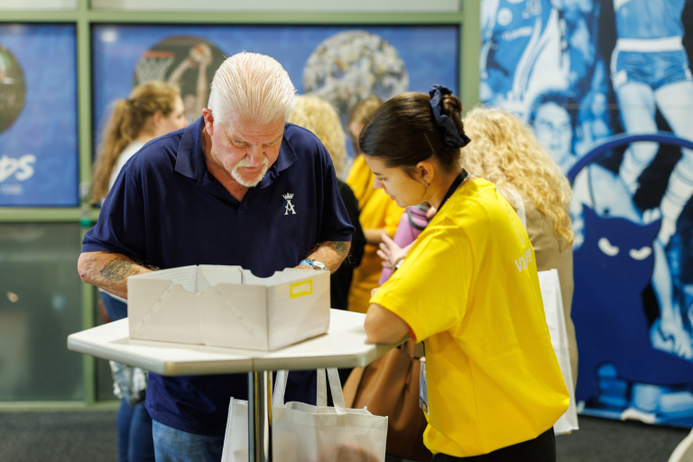 Geelong volunteer helping an attendee